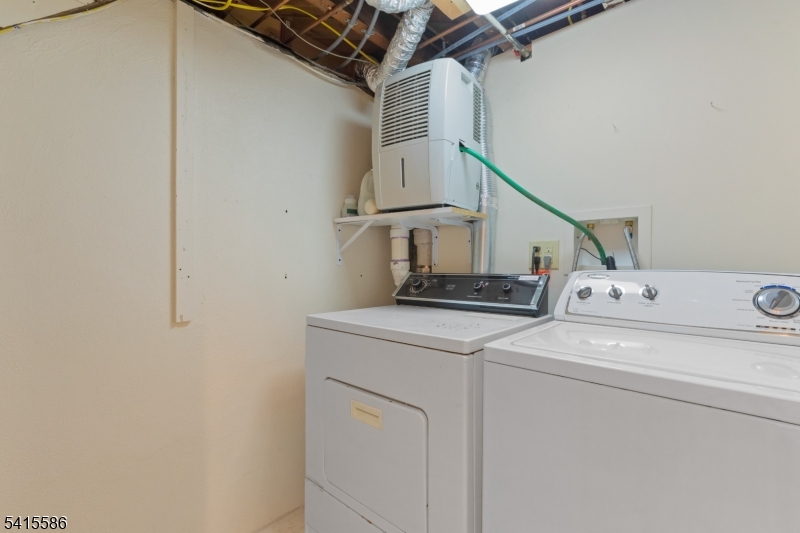 97 McCosh Road Montclair, NJ 07043 - Photo 24 of 25 a utility room with dryer and washer