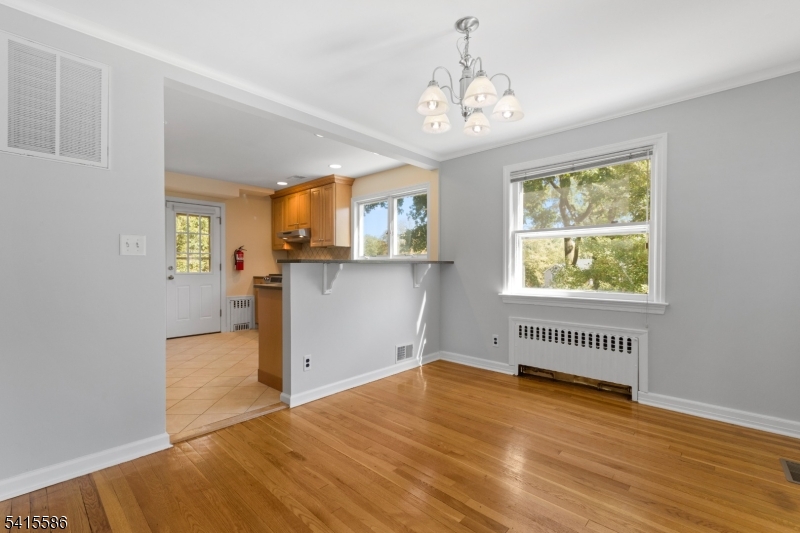 97 McCosh Road Montclair, NJ 07043 - Photo 6 of 25 wooden floor in an empty room with a window