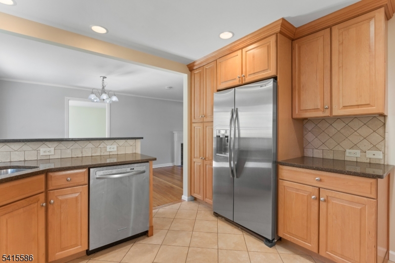 97 McCosh Road Montclair, NJ 07043 - Photo 9 of 25 a kitchen with stainless steel appliances granite countertop a refrigerator a sink and dishwasher