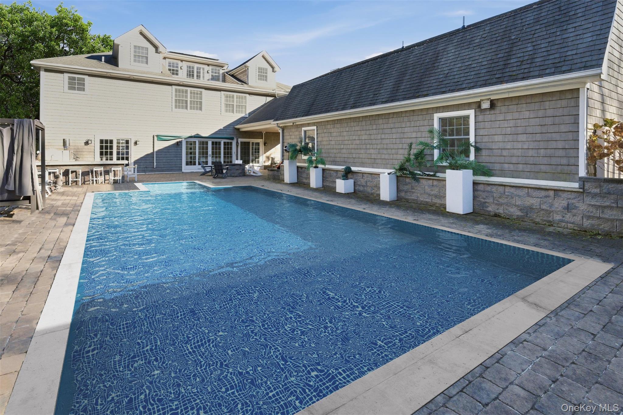 33 A Newtown Road Hampton Bays, NY 11946 - Photo 12 of 50 Outdoor pool featuring a patio