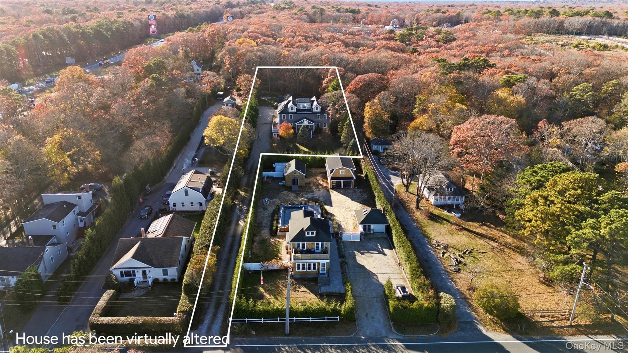 33 A Newtown Road Hampton Bays, NY 11946 - Photo 15 of 50 Aerial view of residential area with property boundaries highlighted and a heavily wooded area