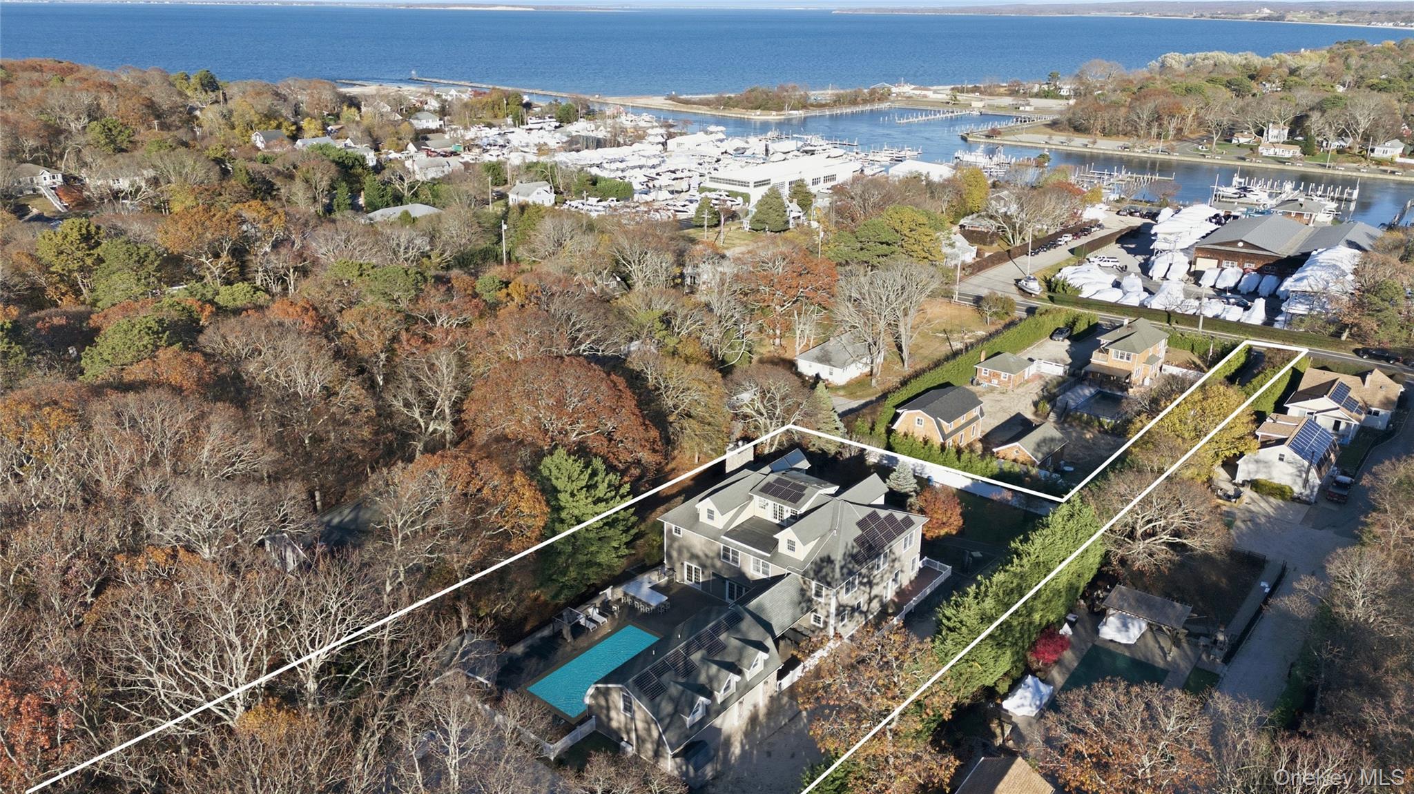 33 A Newtown Road Hampton Bays, NY 11946 - Photo 2 of 50 Aerial view of property's location featuring property parcel outlined and a large body of water