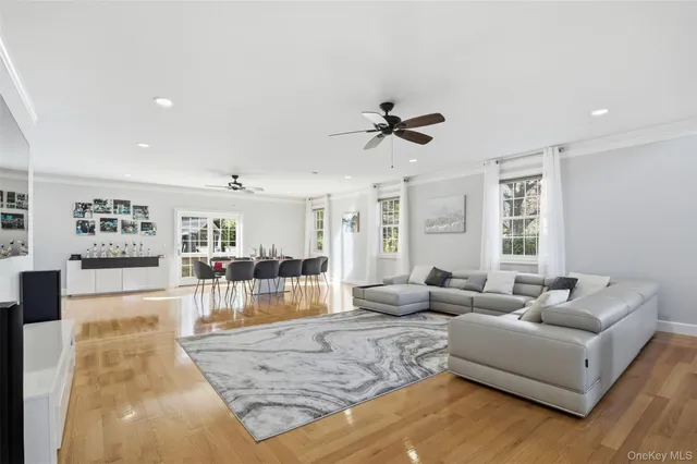 a kitchen with stainless steel appliances granite countertop a table chairs sink refrigerator and microwave