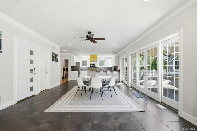 a room with furniture pool table and flat screen tv