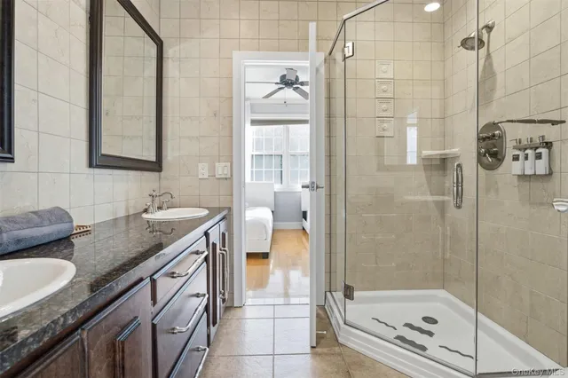 a bathroom with a shower and a sink