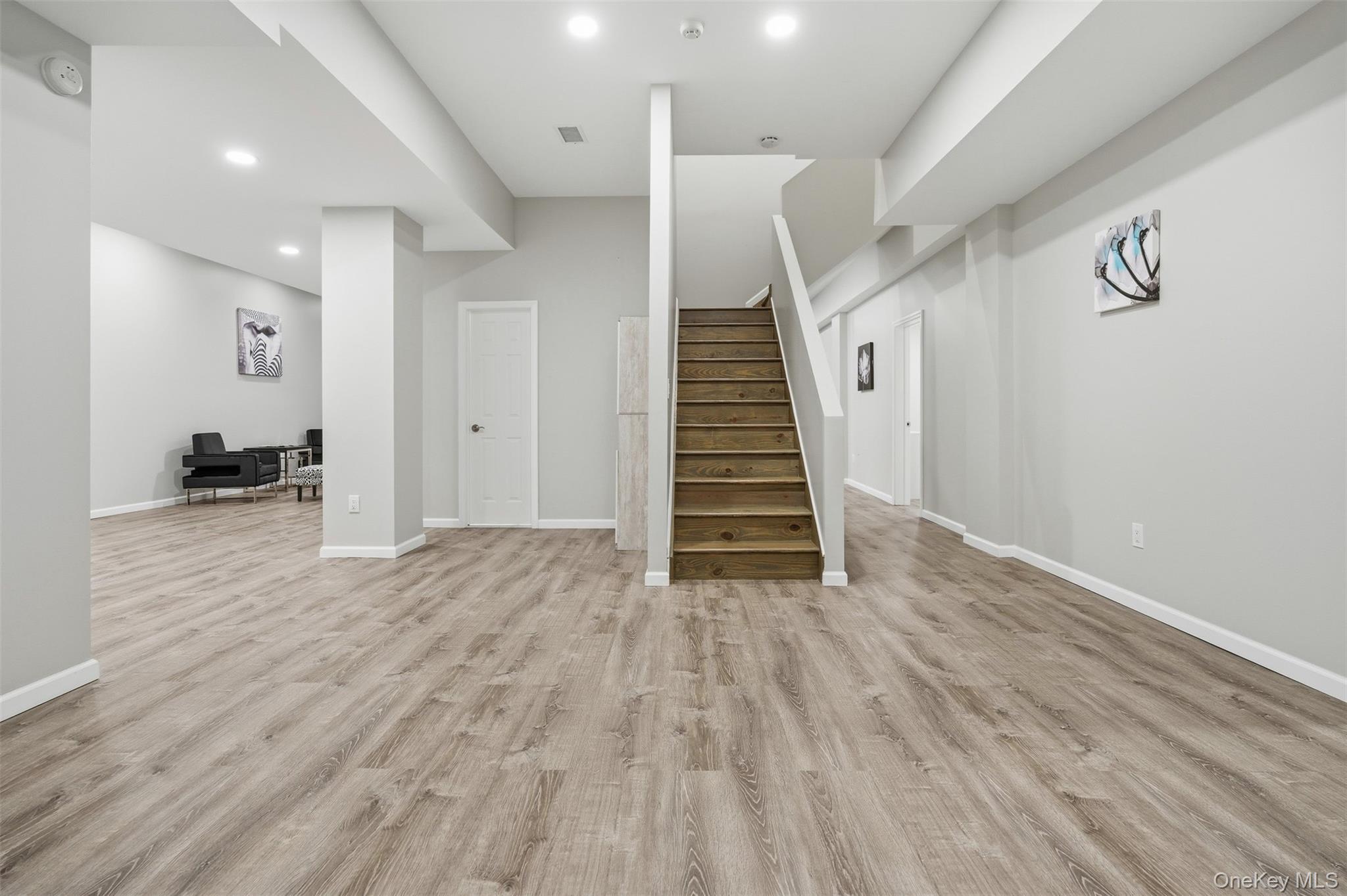 33 A Newtown Road Hampton Bays, NY 11946 - Photo 44 of 50 a view of empty room with wooden floor