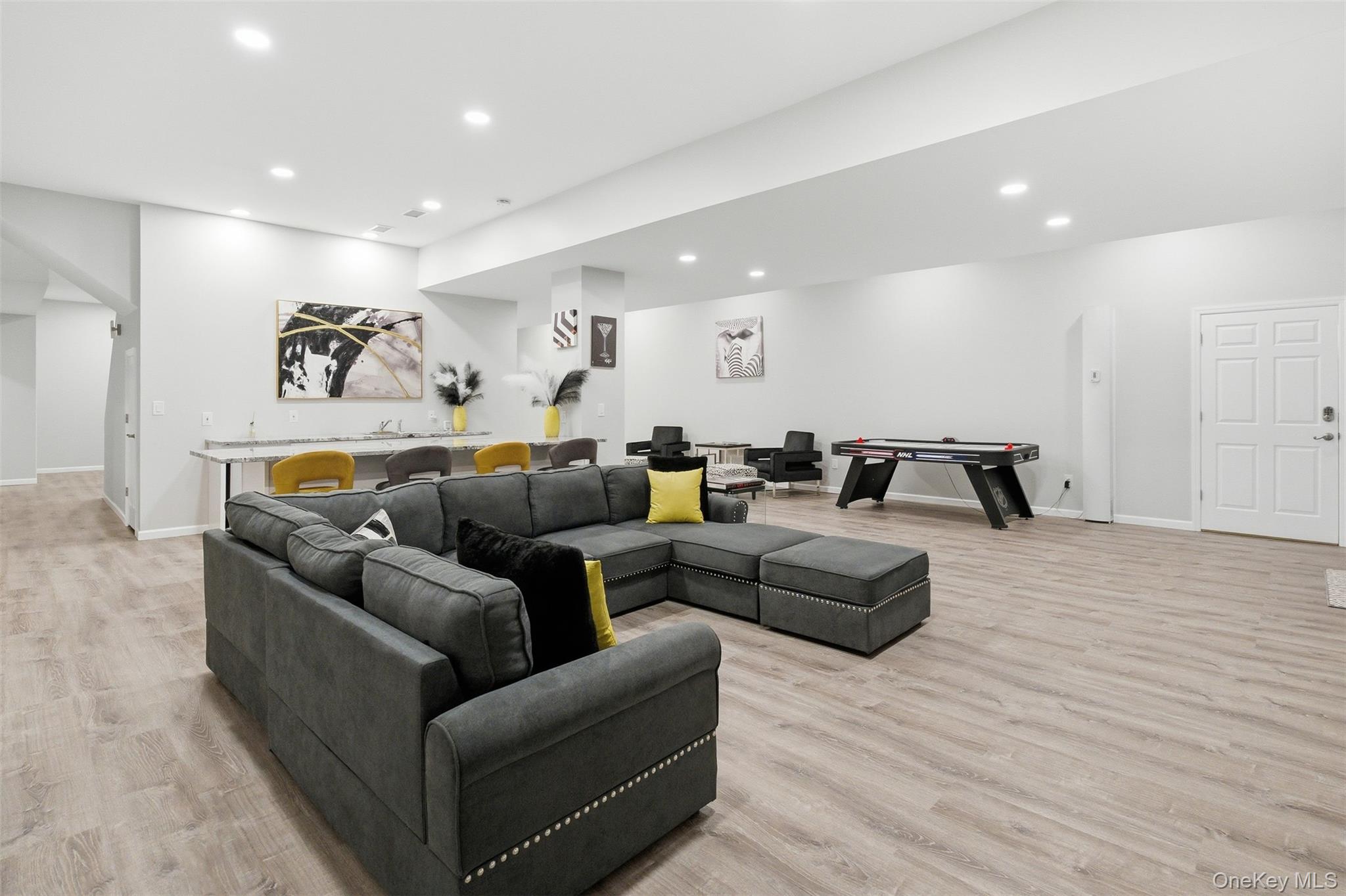 33 A Newtown Road Hampton Bays, NY 11946 - Photo 46 of 50 a living room with furniture and wooden floor