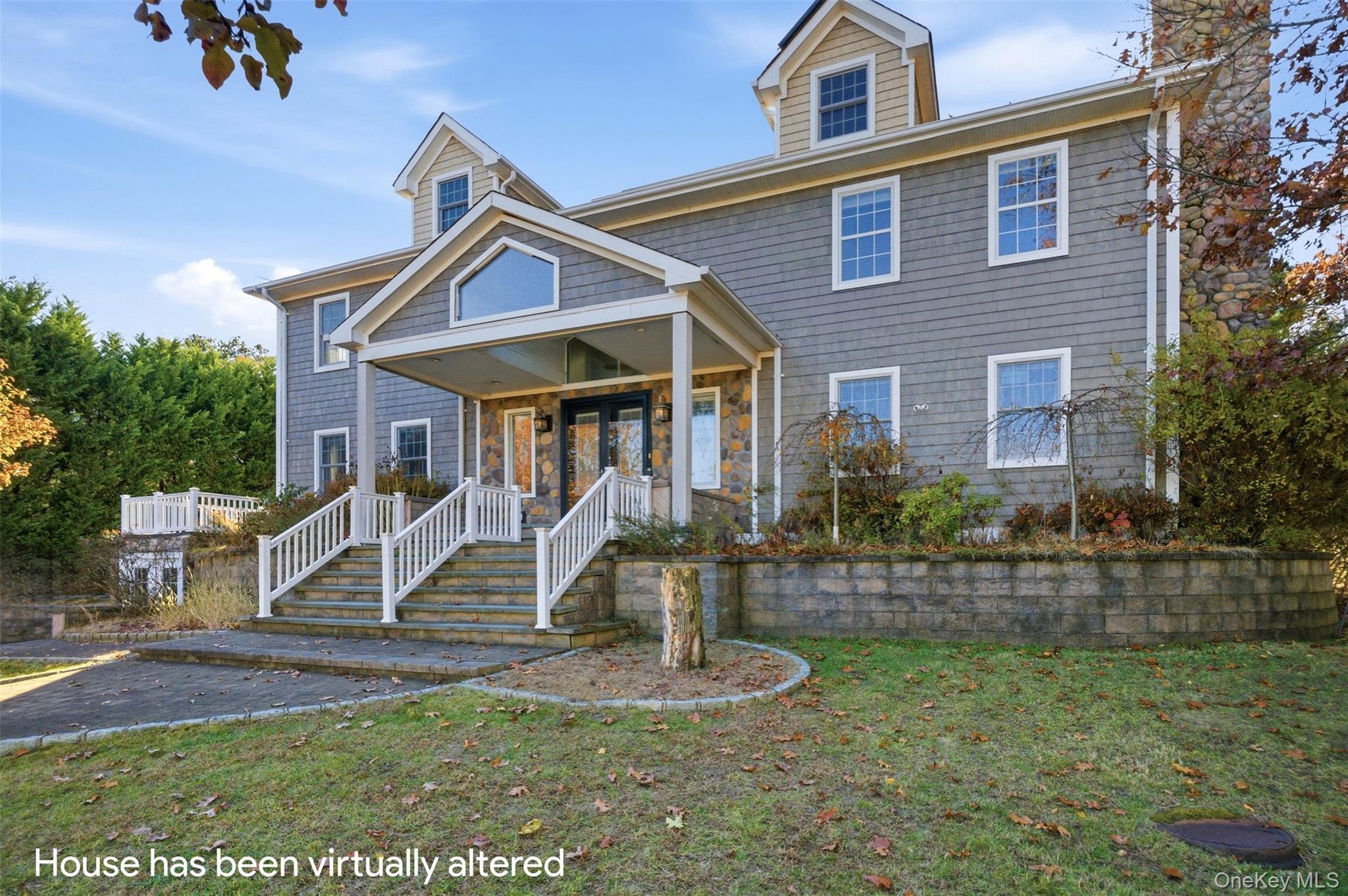 33 A Newtown Road Hampton Bays, NY 11946 - Photo 5 of 50 View of front of property featuring a front lawn, a chimney, and covered porch