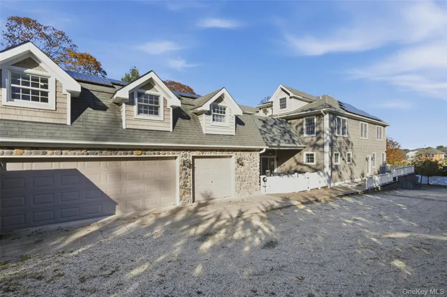 a view of a patio with table and chairs and couches
