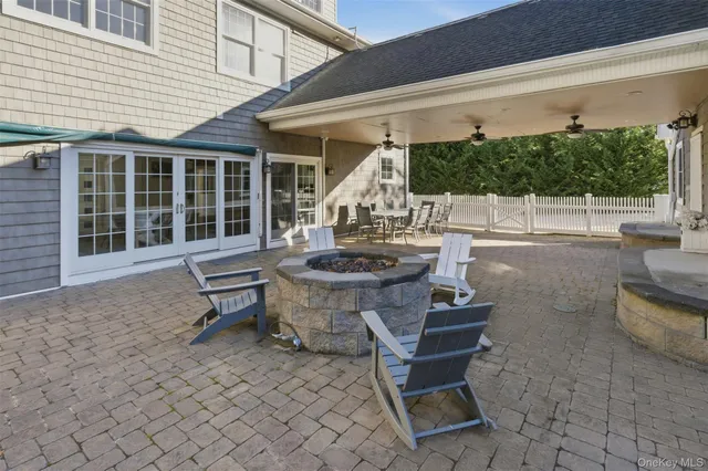 swimming pool view with a seating space