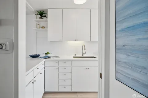 a swimming pool with outdoor seating and yard