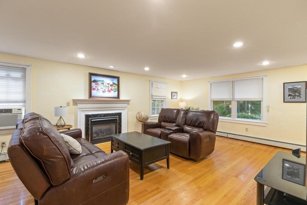15 Labor In Vain Road Ipswich, MA 01938 - Photo 11 of 37 a living room with furniture window and a fireplace