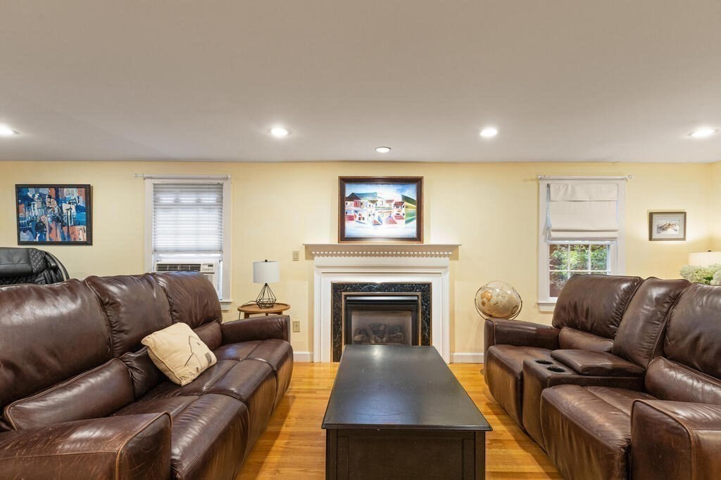 15 Labor In Vain Road Ipswich, MA 01938 - Photo 12 of 37 a living room with furniture and a fireplace