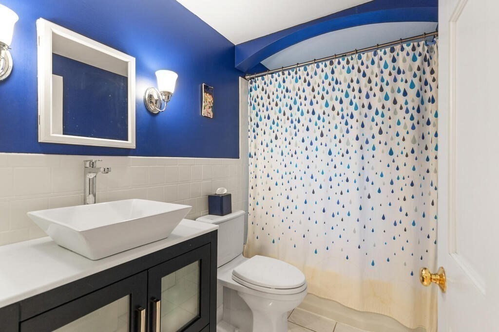 15 Labor In Vain Road Ipswich, MA 01938 - Photo 18 of 37 a bathroom with a sink and a toilet