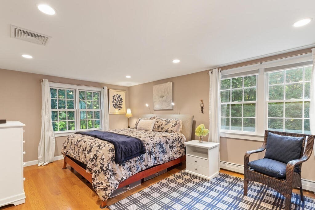 15 Labor In Vain Road Ipswich, MA 01938 - Photo 19 of 37 a bedroom with a large bed and windows