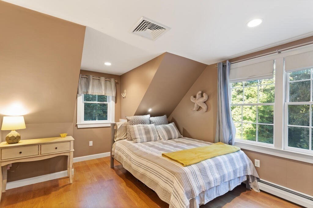 15 Labor In Vain Road Ipswich, MA 01938 - Photo 23 of 37 a bedroom with a large bed and a window