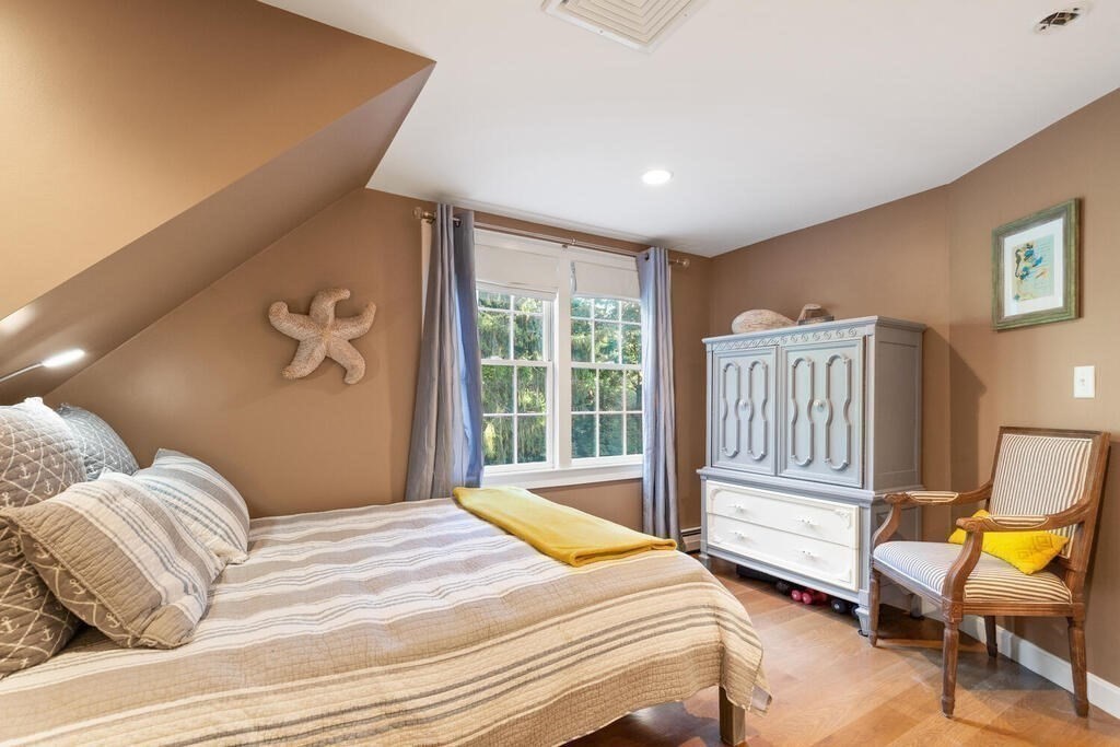 15 Labor In Vain Road Ipswich, MA 01938 - Photo 24 of 37 a bedroom with a bed and a window