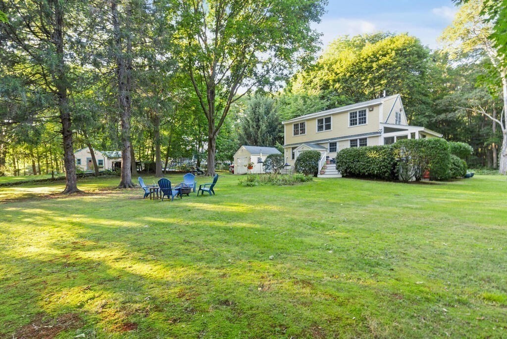 15 Labor In Vain Road Ipswich, MA 01938 - Photo 30 of 37 a front view of a house with garden and trees