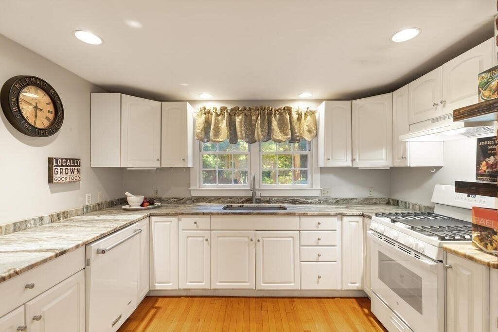15 Labor In Vain Road Ipswich, MA 01938 - Photo 7 of 37 a kitchen with cabinets stainless steel appliances a sink and a window