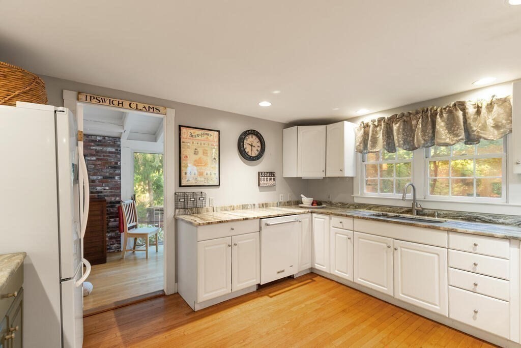 15 Labor In Vain Road Ipswich, MA 01938 - Photo 8 of 37 a kitchen with a sink stove and cabinets