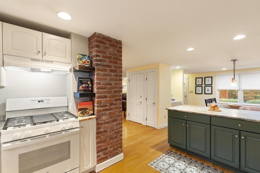 15 Labor In Vain Road Ipswich, MA 01938 - Photo 9 of 37 a kitchen with a stove and a sink