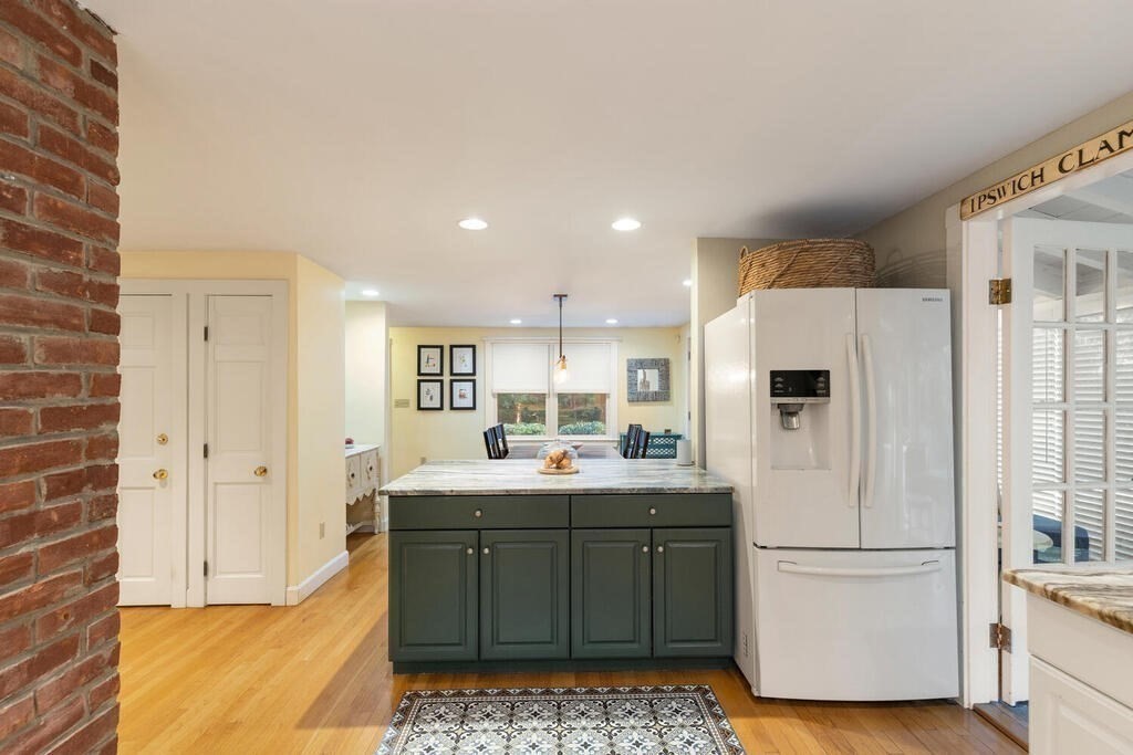 15 Labor In Vain Road Ipswich, MA 01938 - Photo 10 of 37 a kitchen with a sink stainless steel appliances and cabinets
