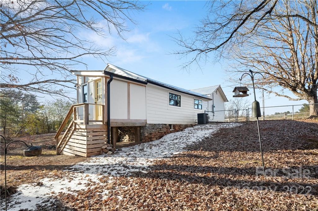 20 Indian Camp Branch Road Weaverville, NC 28787 - Photo 16 of 18 a front view of a house with a yard