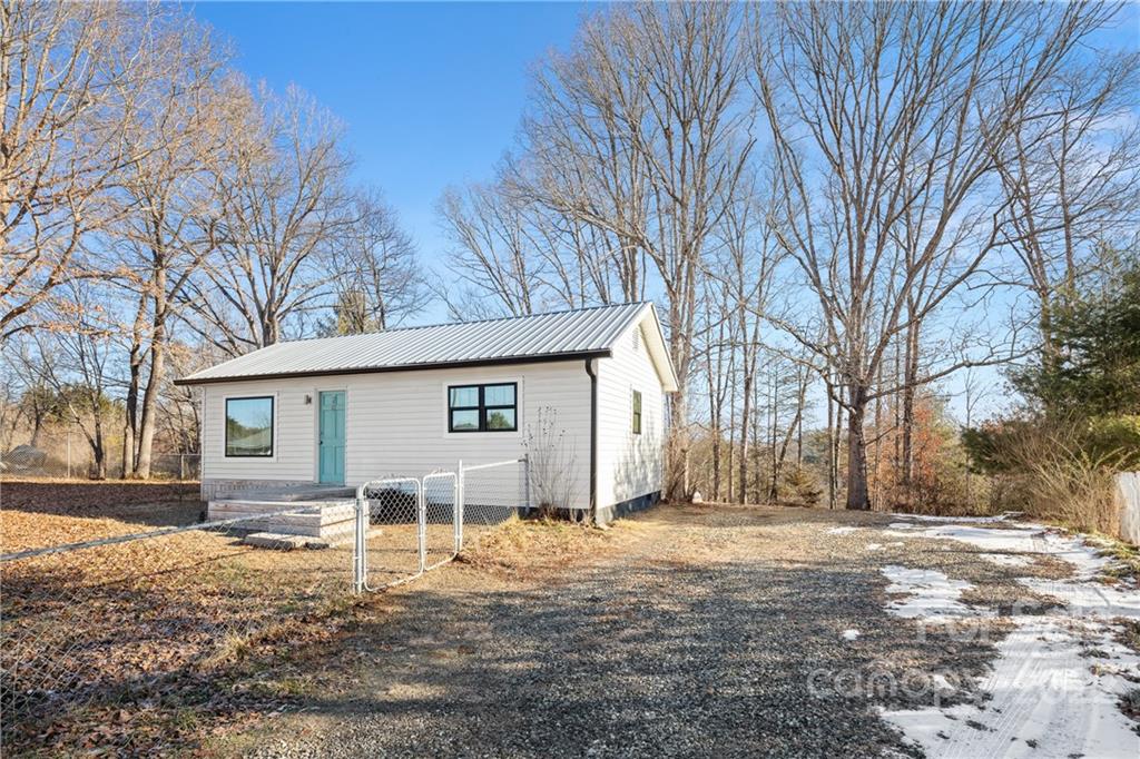 20 Indian Camp Branch Road Weaverville, NC 28787 - Photo 2 of 18 a view of a house with a yard covered in snow