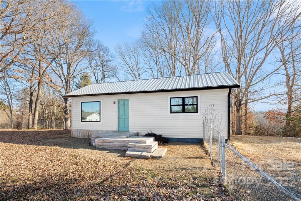 20 Indian Camp Branch Road Weaverville, NC 28787 - Photo 3 of 18 a view of a house with a yard covered in snow