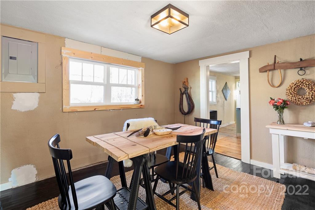 20 Indian Camp Branch Road Weaverville, NC 28787 - Photo 7 of 18 a view of a dining room with furniture and wooden floor