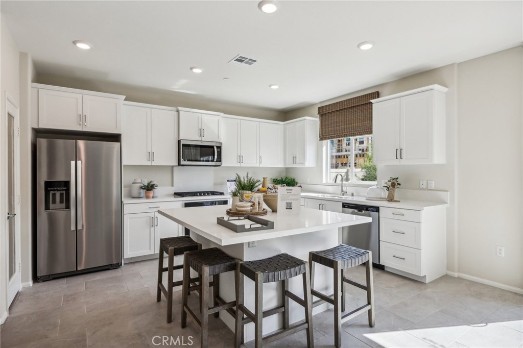 83239 Pintail Lane Indio, CA 92201 - Photo 13 of 45 a kitchen with a dining table and chairs