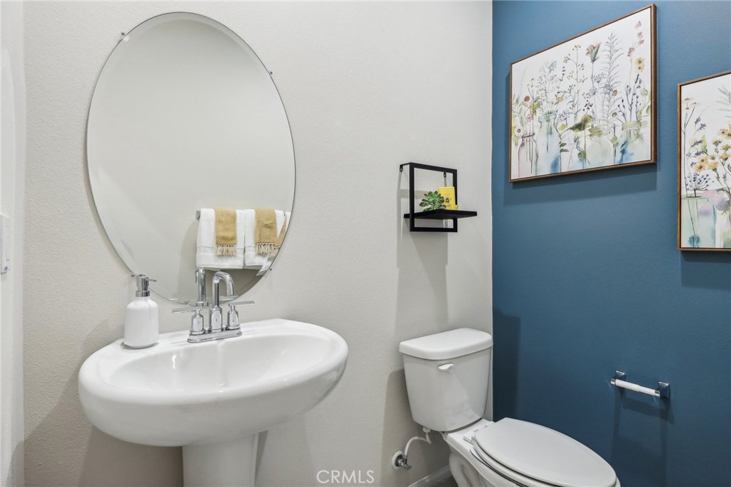 83239 Pintail Lane Indio, CA 92201 - Photo 21 of 45 a bathroom with a toilet sink and mirror