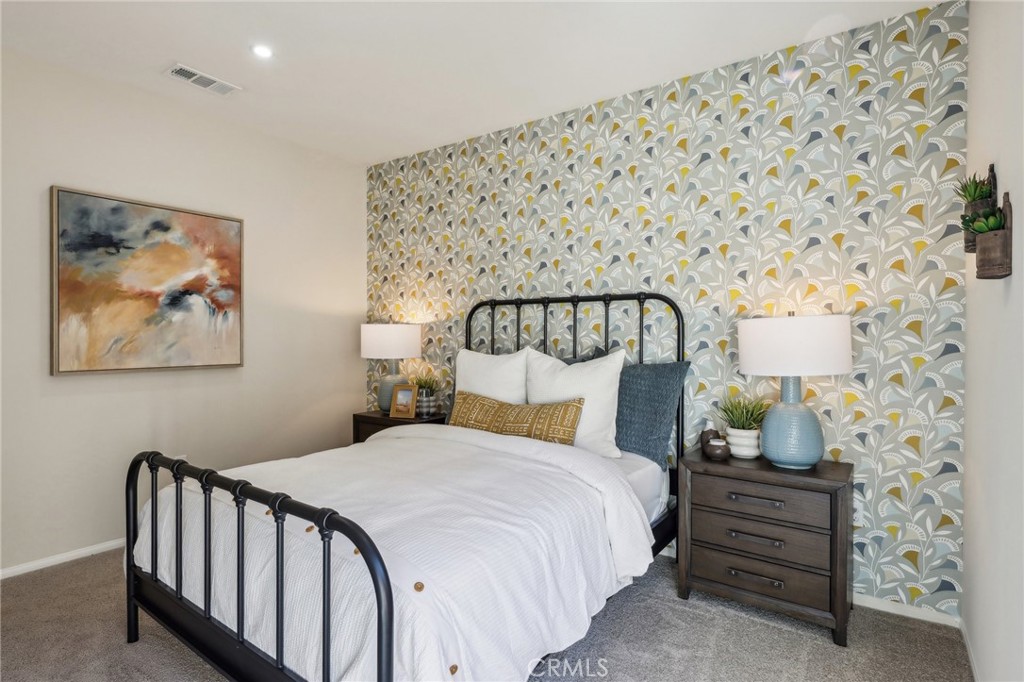 83239 Pintail Lane Indio, CA 92201 - Photo 23 of 45 a bedroom with a bed and a lamp on dresser