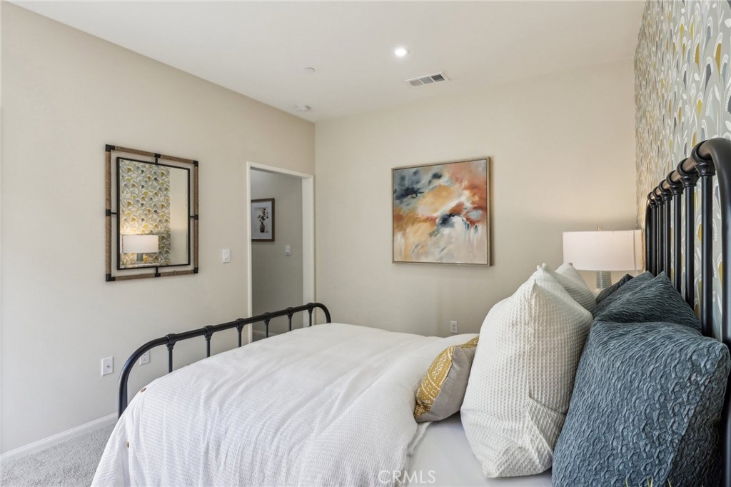 83239 Pintail Lane Indio, CA 92201 - Photo 24 of 45 a bedroom with a bed and a painting on the wall