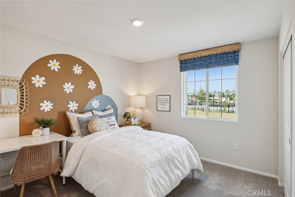 83239 Pintail Lane Indio, CA 92201 - Photo 31 of 45 a bedroom with a bed and a painting on the wall