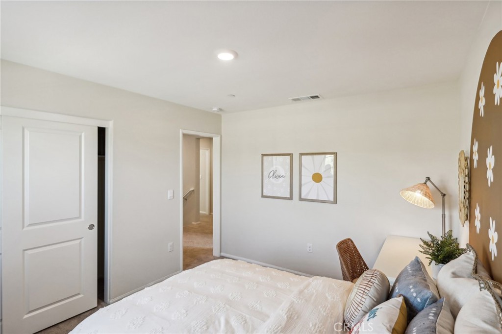 83239 Pintail Lane Indio, CA 92201 - Photo 32 of 45 a bedroom with a bed and a couch