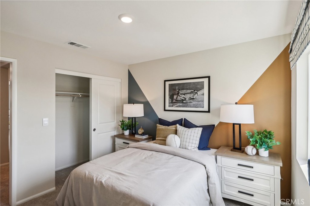 83239 Pintail Lane Indio, CA 92201 - Photo 34 of 45 a bedroom with a bed and a flat screen tv