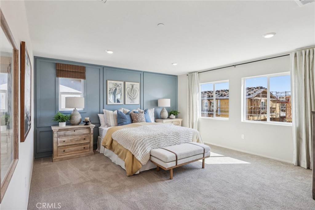 83239 Pintail Lane Indio, CA 92201 - Photo 35 of 45 a spacious bedroom with a large bed and windows