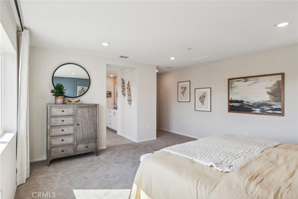 83239 Pintail Lane Indio, CA 92201 - Photo 37 of 45 a bedroom with a bed and a mirror