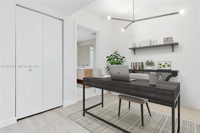 a bathroom with a tub sink and mirror
