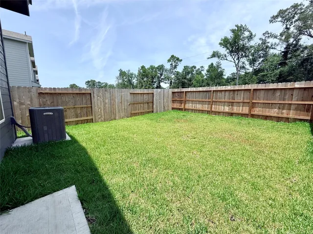 a view of a backyard with a small cabin