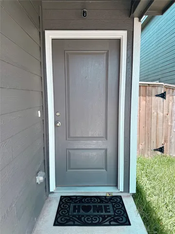 a view of a door and a window