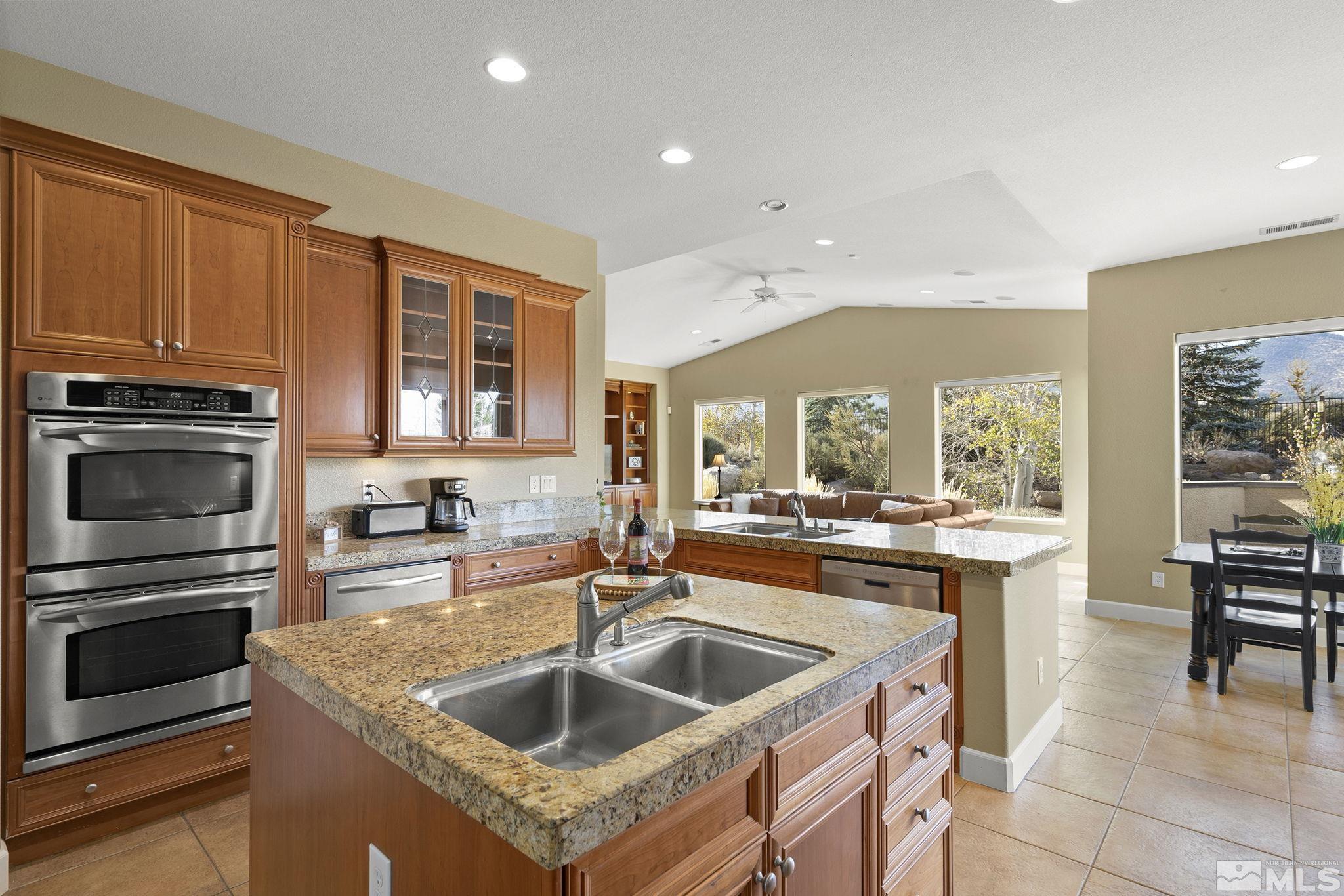 15300 Redmond Loop Reno, NV 89511 - Photo 12 of 38 a kitchen with a stove sink and microwave