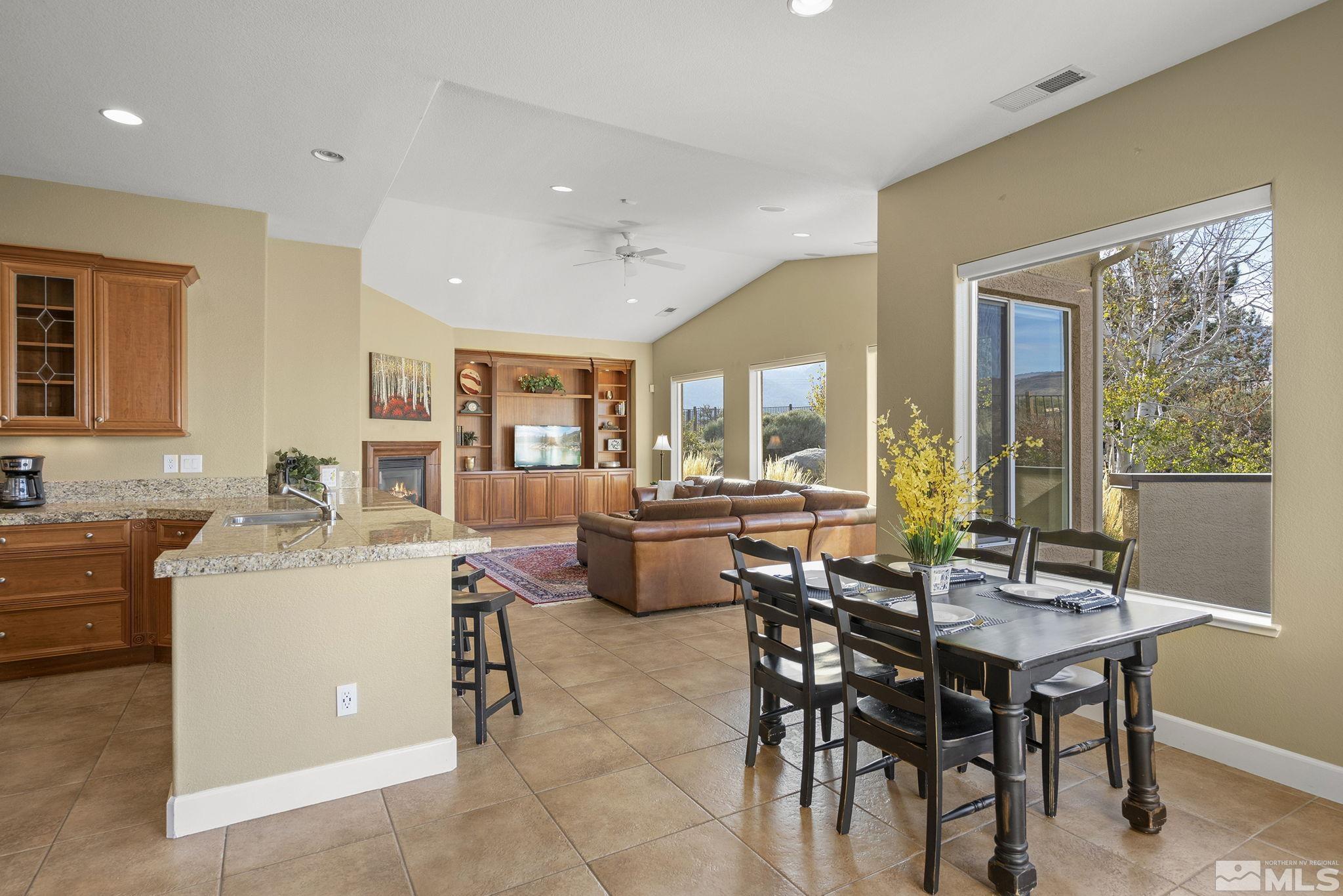 15300 Redmond Loop Reno, NV 89511 - Photo 14 of 38 a view of a dining room with furniture and wooden floor
