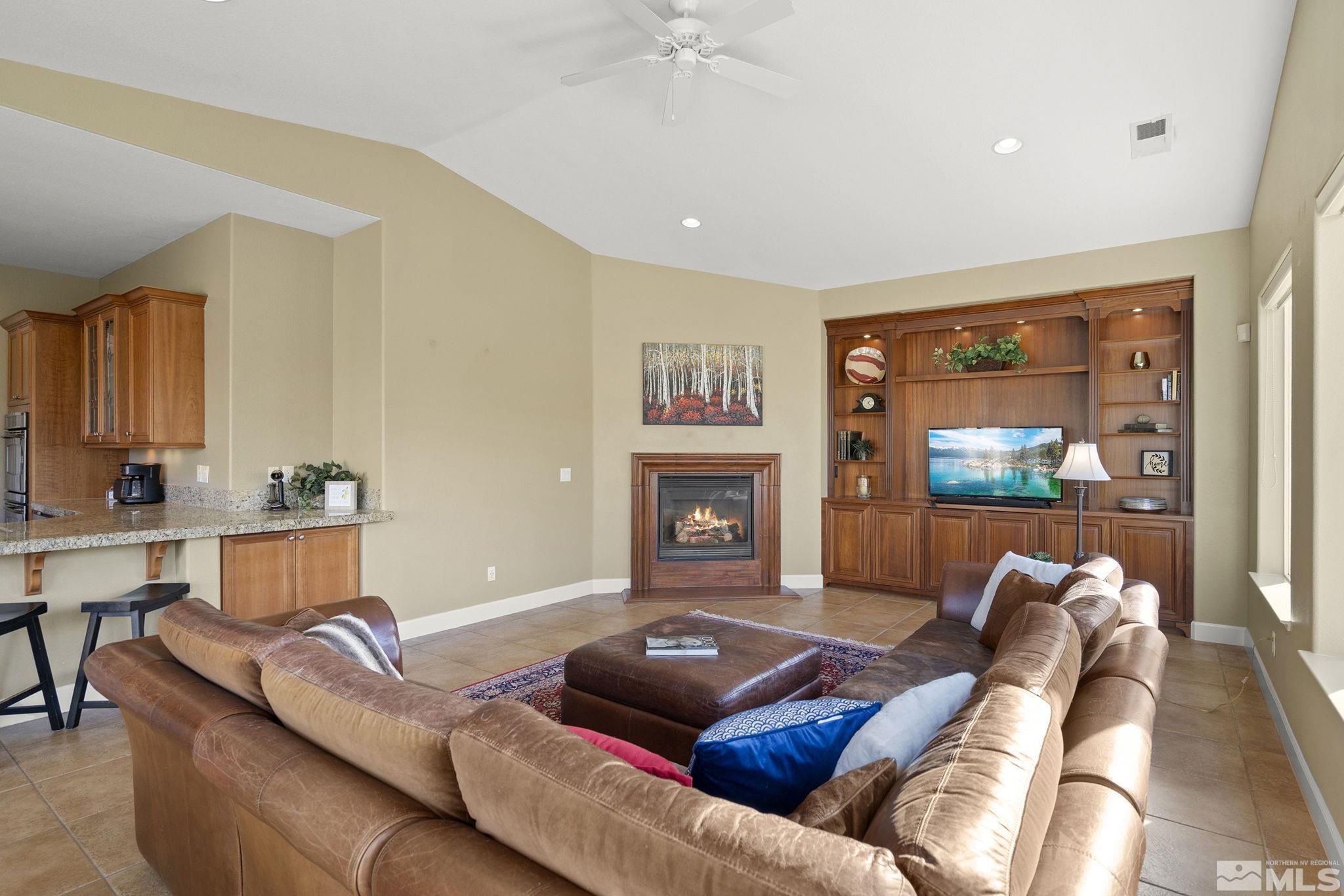 15300 Redmond Loop Reno, NV 89511 - Photo 17 of 38 a living room with furniture and a flat screen tv