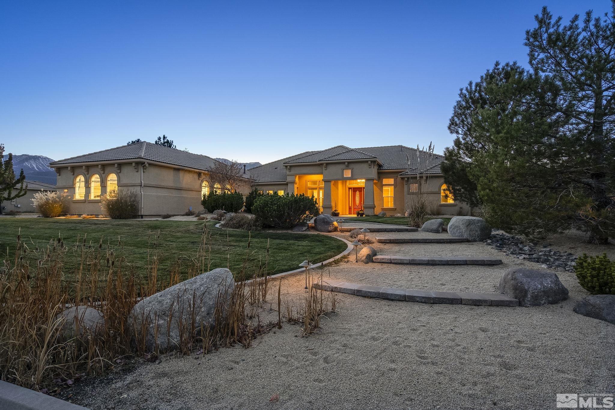 15300 Redmond Loop Reno, NV 89511 - Photo 2 of 38 a view of a house with backyard and garden