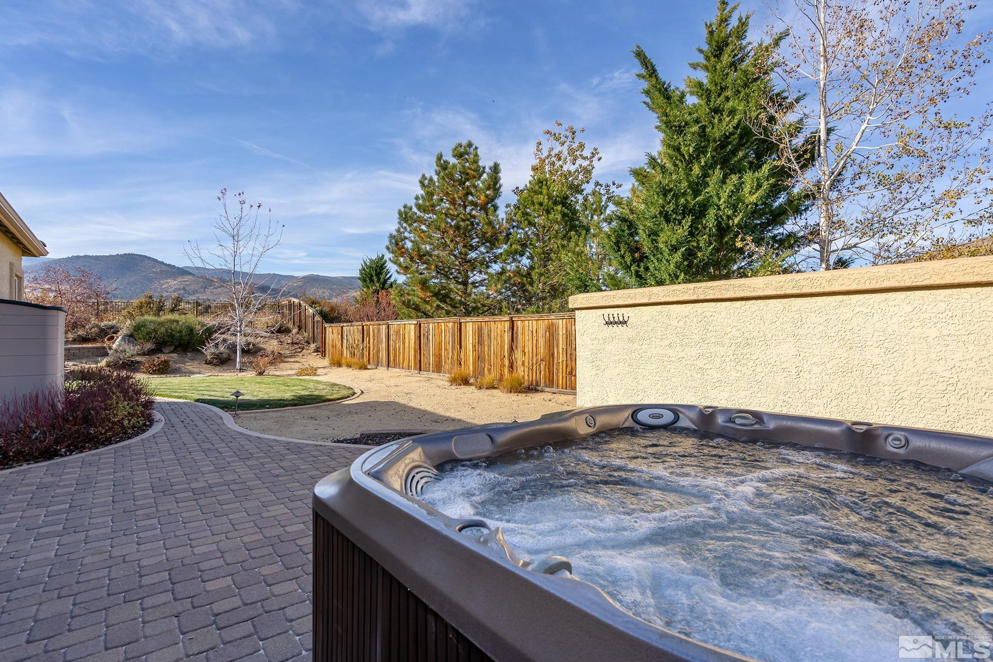 15300 Redmond Loop Reno, NV 89511 - Photo 24 of 38 a view of a backyard and a tub