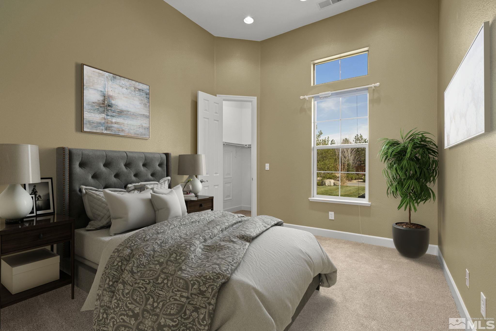 15300 Redmond Loop Reno, NV 89511 - Photo 27 of 38 a bedroom with bed and a window