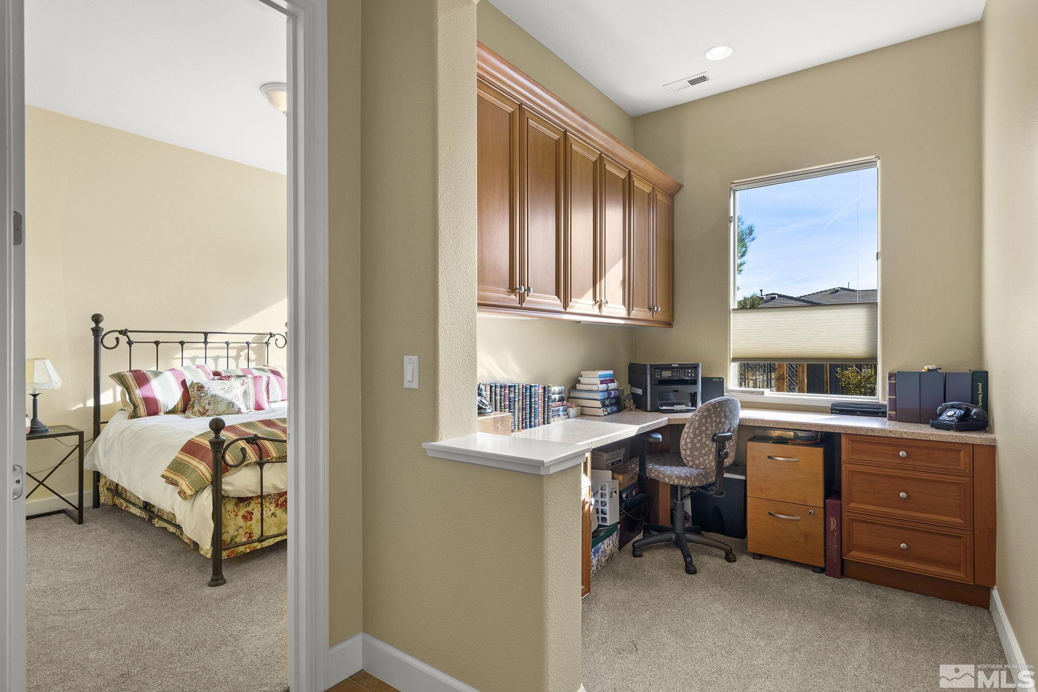 15300 Redmond Loop Reno, NV 89511 - Photo 29 of 38 a bedroom with a bed and a window