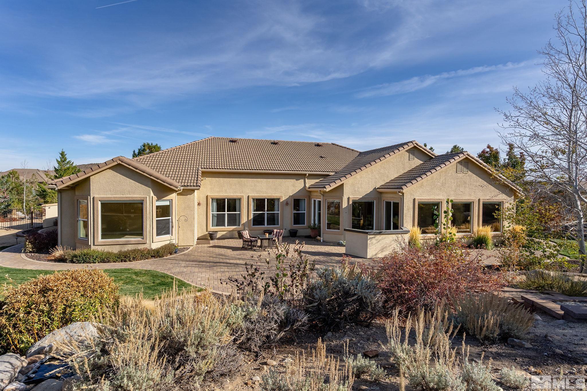 15300 Redmond Loop Reno, NV 89511 - Photo 33 of 38 a front view of a house with garden
